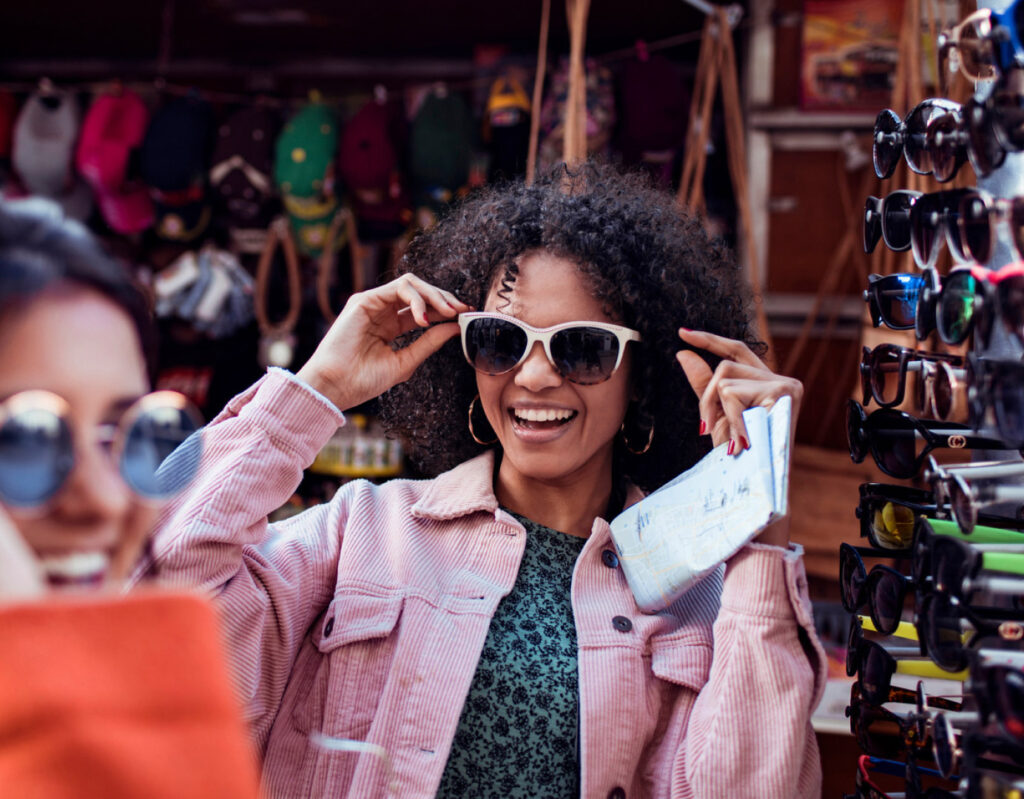 a girl shopping for sunglasses